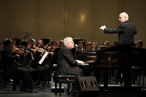 Conductor Bill Grimes leads the Louisiana Philharmonic and Randy